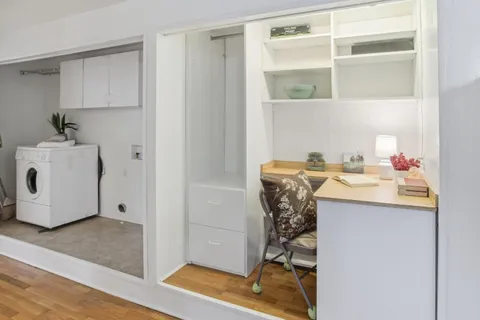 a bathroom with a sink toilet and a mirror