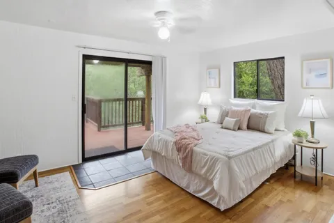 a bedroom with a bed and a desk