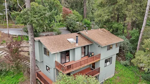 an aerial view of a house with a garden
