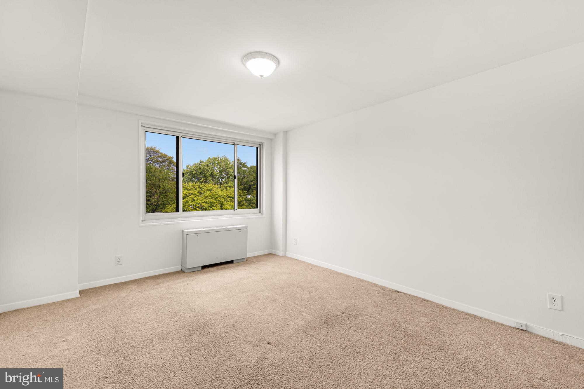 1900 Lyttonsville Road, Unit 818 Silver Spring, MD 20910 - Photo 15 of 23 an empty room with windows