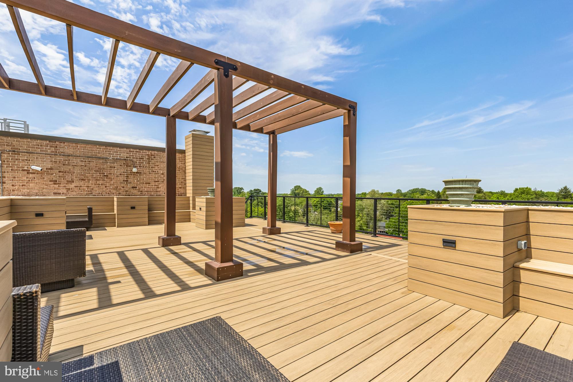 1900 Lyttonsville Road, Unit 818 Silver Spring, MD 20910 - Photo 17 of 23 a view of roof deck with seating space and city view