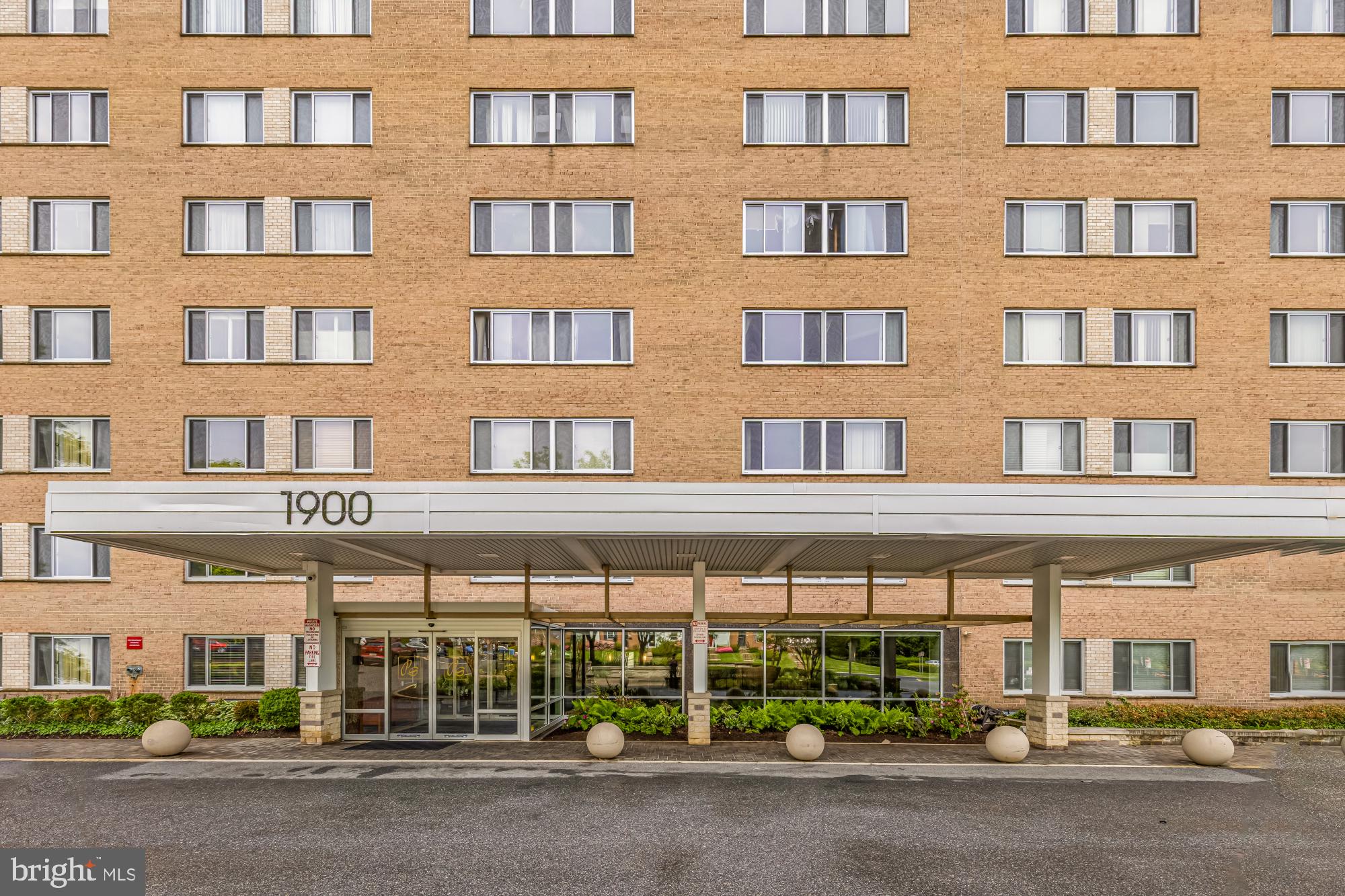 1900 Lyttonsville Road, Unit 818 Silver Spring, MD 20910 - Photo 2 of 23 a view of a brick building with a street