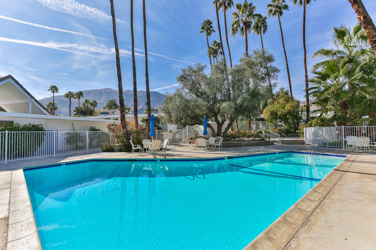 42308 Dunes View Road, Unit 20 Rancho Mirage, CA 92270 - Photo 3 of 30 a view of a swimming pool with a patio