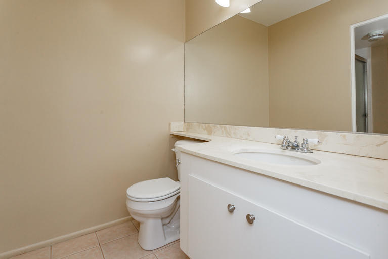 42308 Dunes View Road, Unit 20 Rancho Mirage, CA 92270 - Photo 21 of 30 a bathroom with a granite countertop toilet and a sink