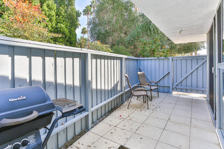42308 Dunes View Road, Unit 20 Rancho Mirage, CA 92270 - Photo 26 of 30 a view of a patio with wooden floor