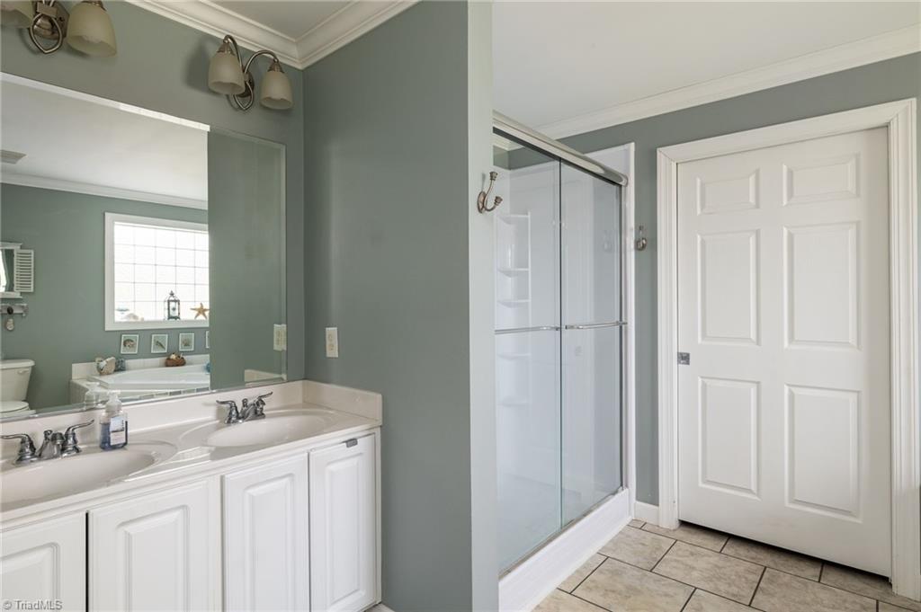 447 Culler Road Pinnacle, NC 27043 - Photo 14 of 36 Ensuite with walk-in shower and jetted tub