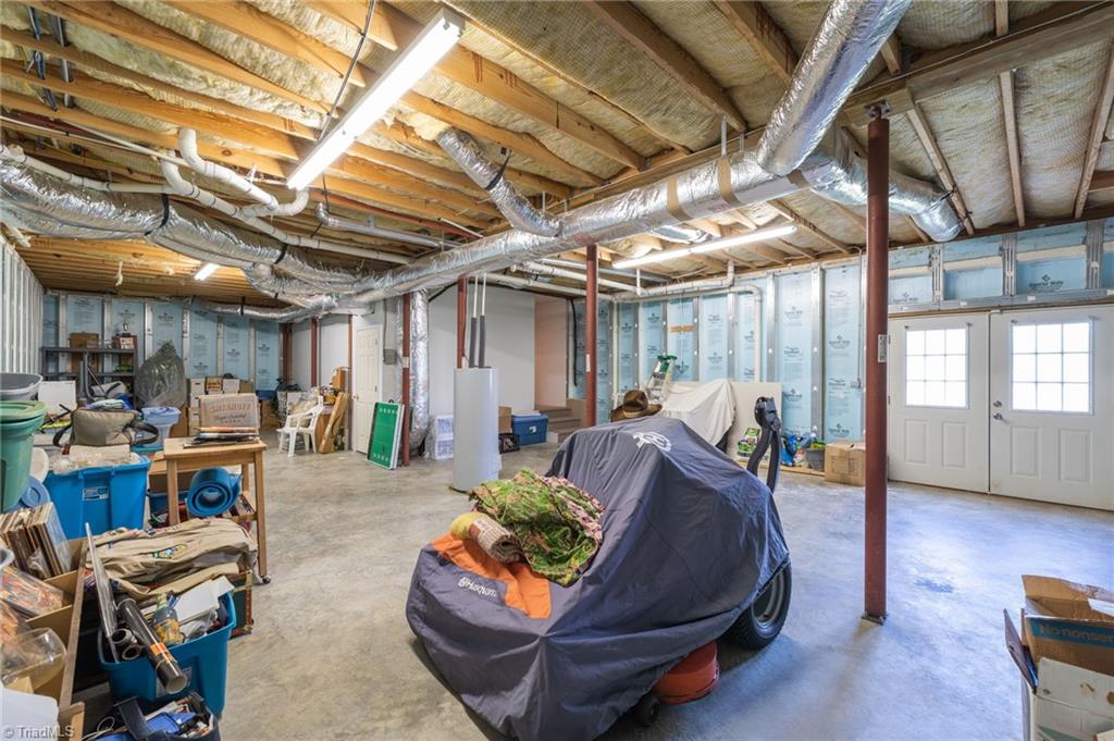 447 Culler Road Pinnacle, NC 27043 - Photo 29 of 36 Basement and workshop area with french door walk out
