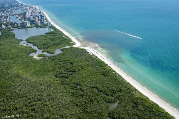 a view of a lake with a building in the background
