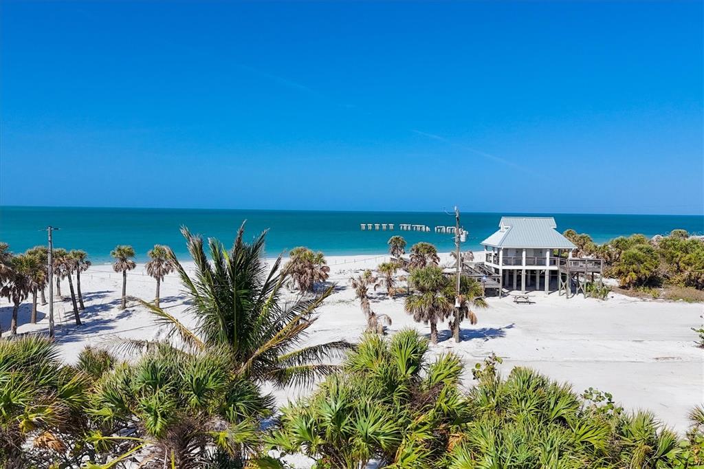 862 Grande Pass Way Boca Grande, FL 33921 - Photo 8 of 22 a view of a lake with a yard