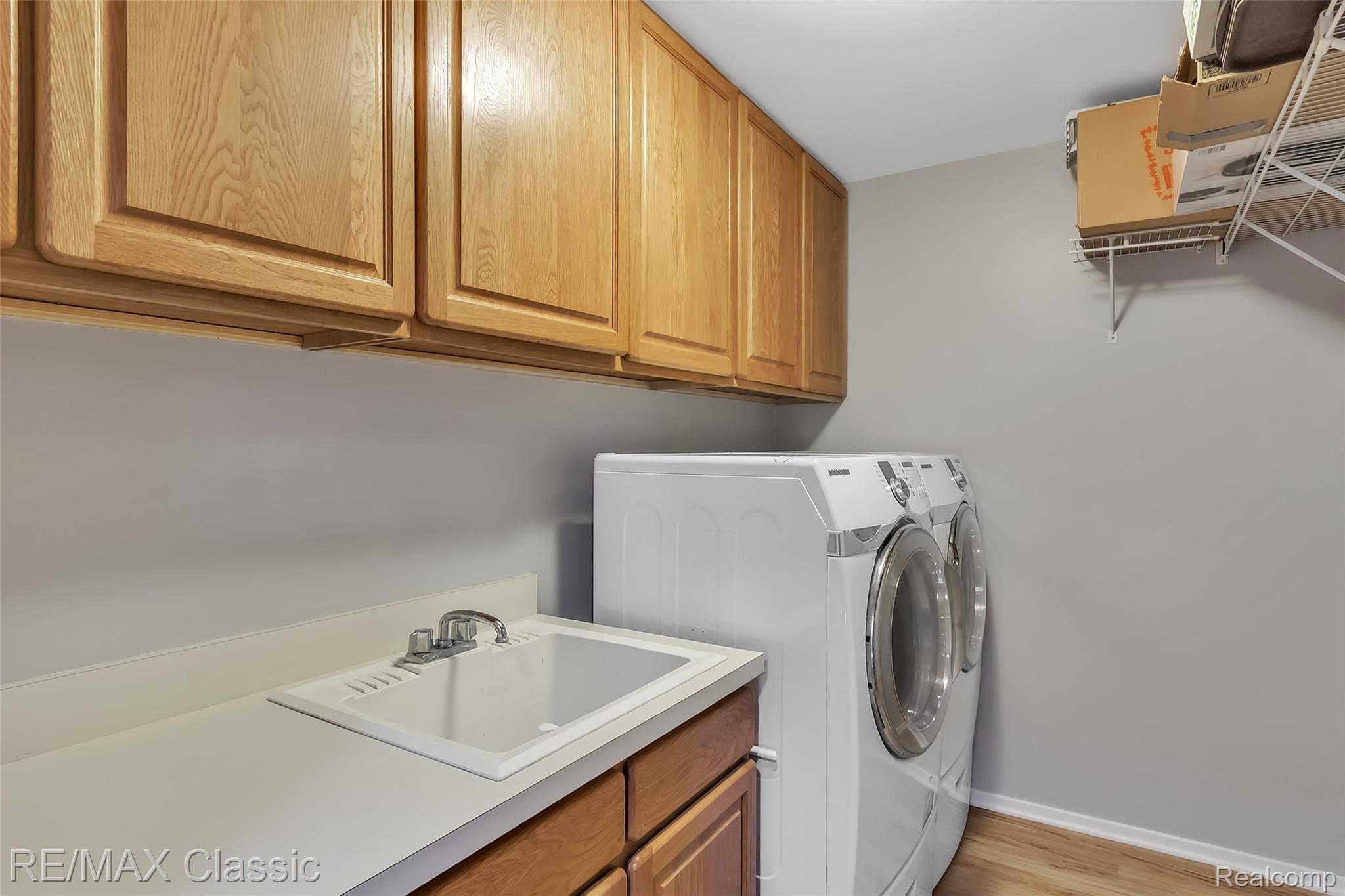 3344 Rivers Edge Drive Wayne, MI 48184 - Photo 43 of 50 Entry Level/first floor laundry. with oak cabinets, washer and dryer are included.