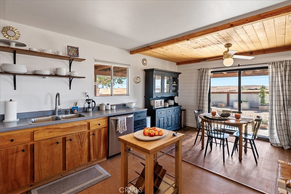 3815 Highway 41 Paso Robles, CA 93446 - Photo 15 of 40 a kitchen with a table chairs stove and cabinets