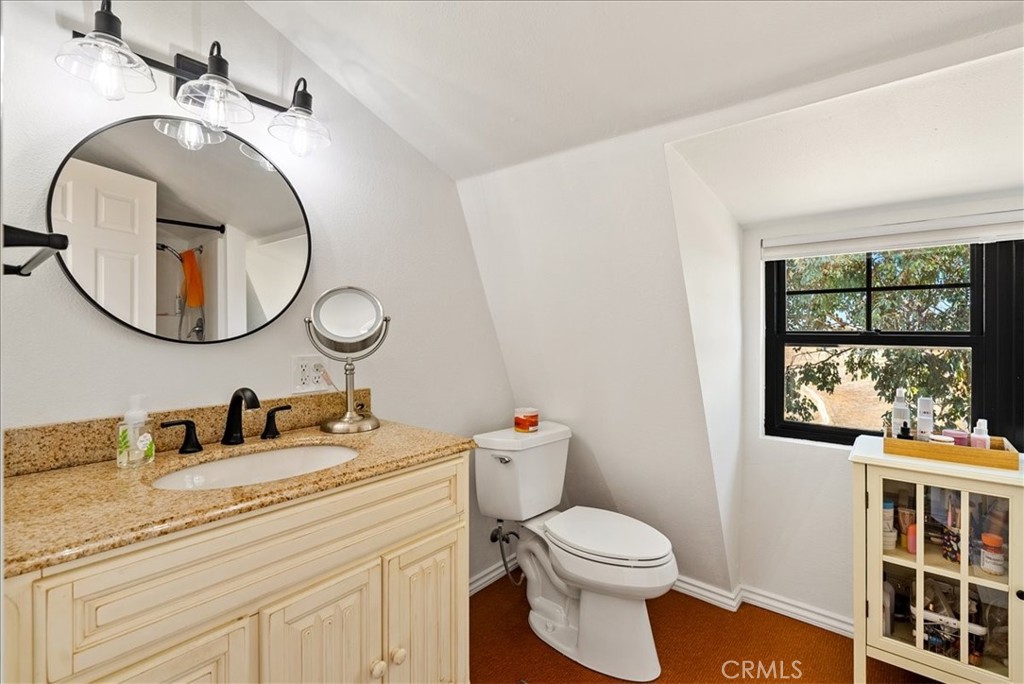 3815 Highway 41 Paso Robles, CA 93446 - Photo 24 of 40 a bathroom with a toilet a sink and a mirror