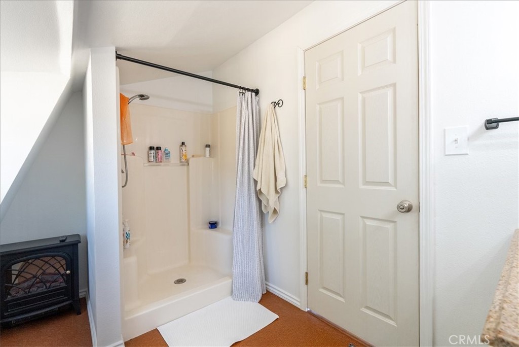3815 Highway 41 Paso Robles, CA 93446 - Photo 26 of 40 a bathroom with a glass shower door