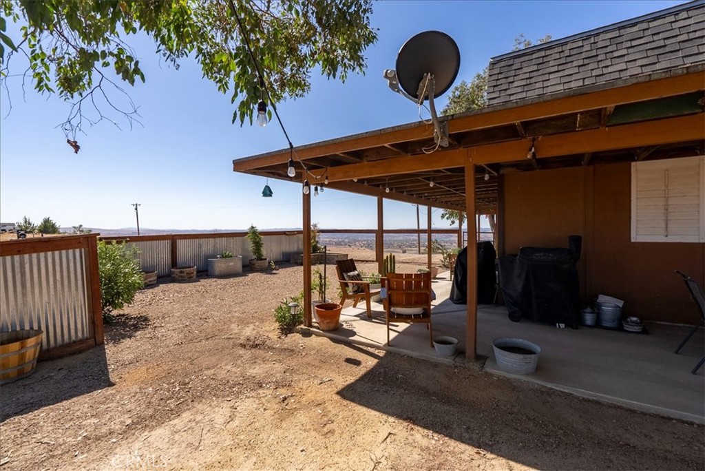 3815 Highway 41 Paso Robles, CA 93446 - Photo 33 of 40 a view of a patio with a table chairs and a potted plant