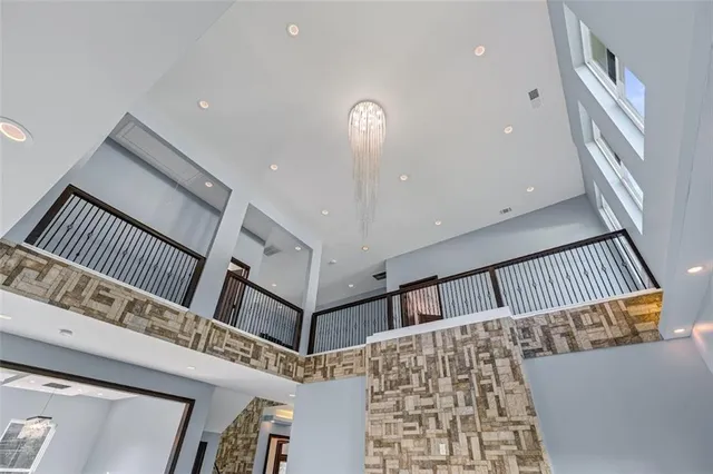 a view of staircase with a ceiling fan