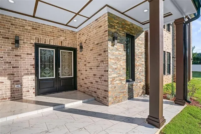 a view of a brick house with a large window