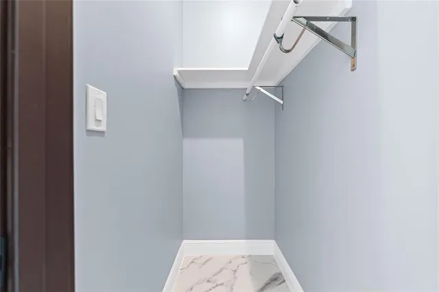 a view of living room with wooden floor and window