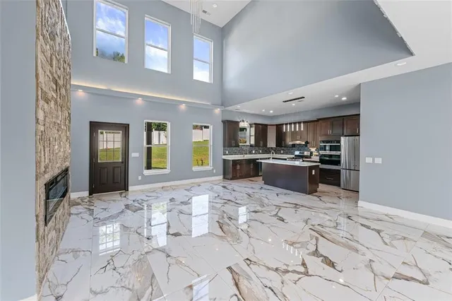 a large kitchen with a stove and cabinets