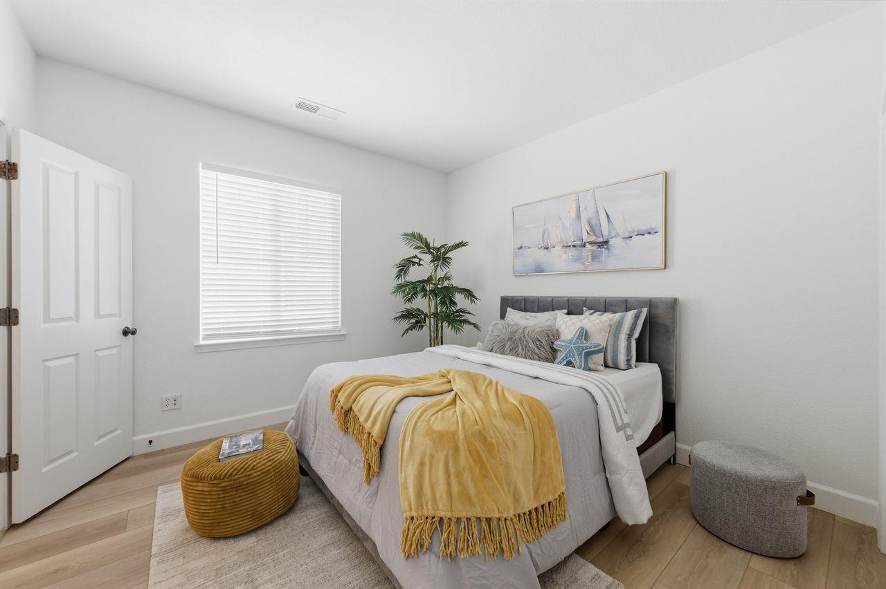 698 West Rico Way Tracy, CA 95391 - Photo 26 of 38 a bedroom with a bed and window