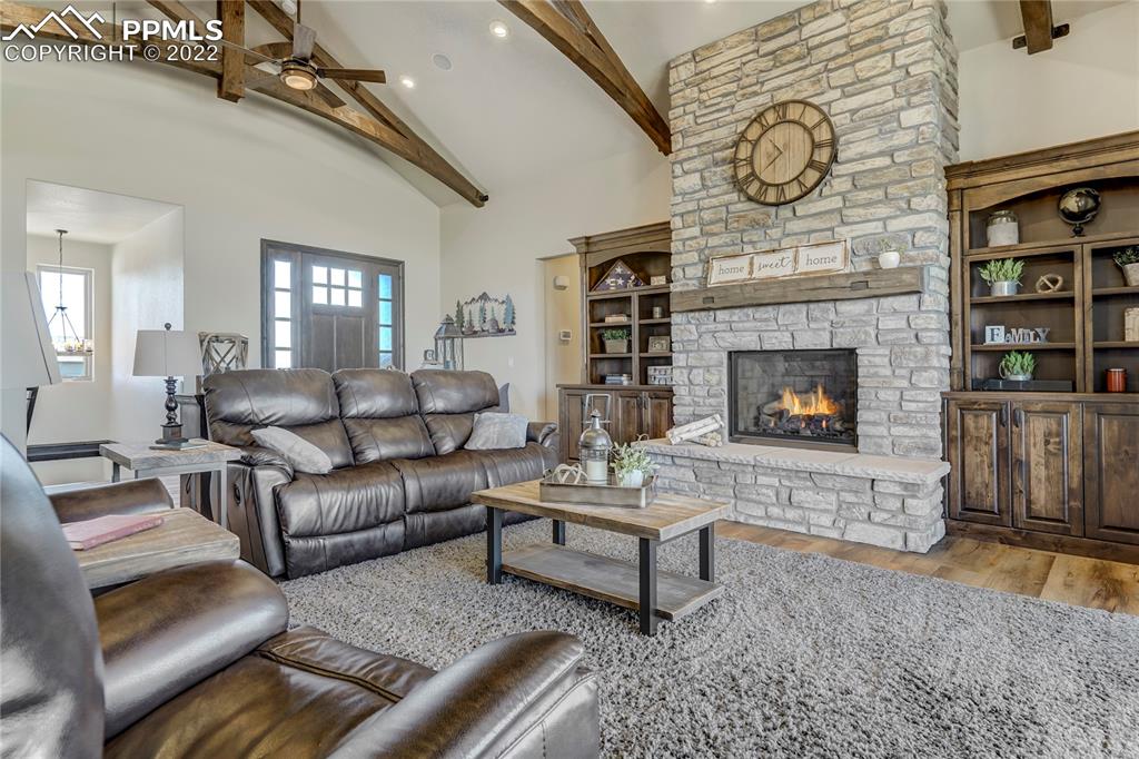 14325 Evans Road Elbert, CO 80106 - Photo 11 of 49 a living room with furniture and a fireplace