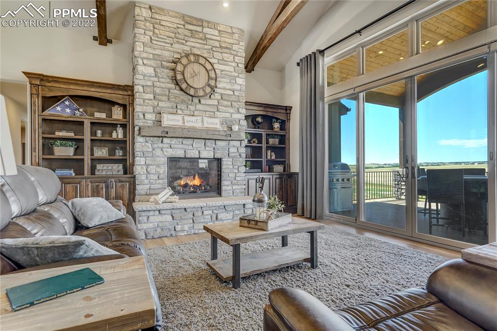 14325 Evans Road Elbert, CO 80106 - Photo 12 of 49 a living room with furniture and a fireplace