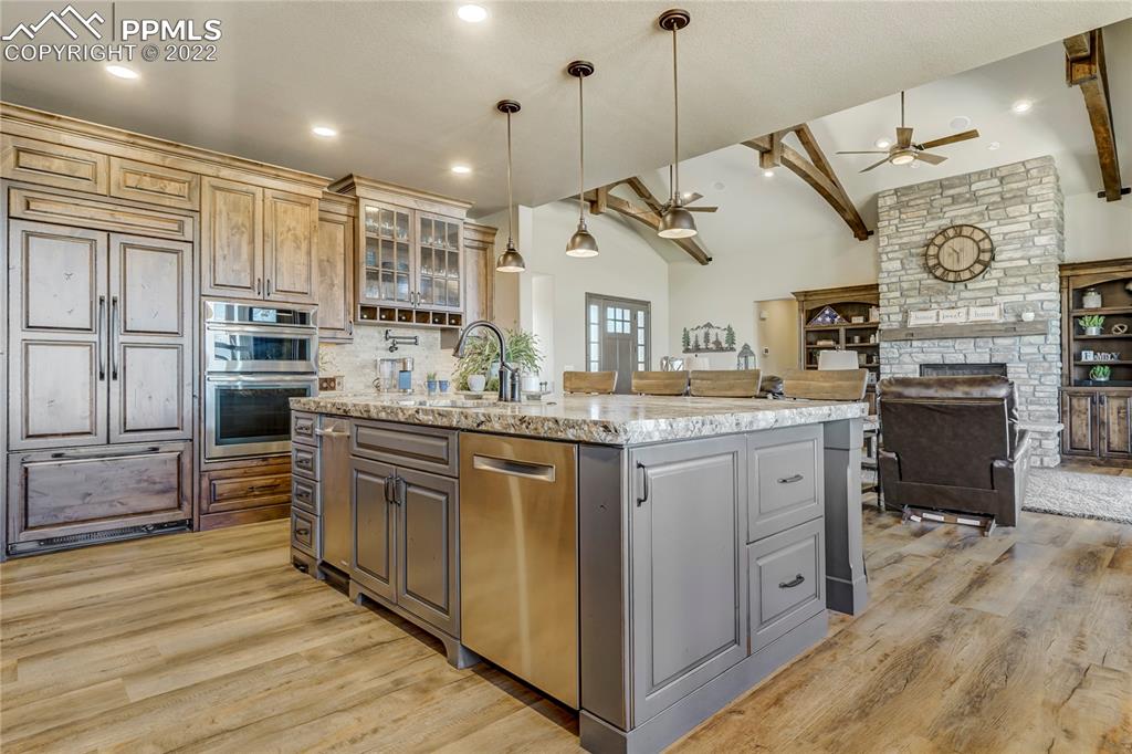 14325 Evans Road Elbert, CO 80106 - Photo 15 of 49 a kitchen with stainless steel appliances granite countertop a stove and cabinets