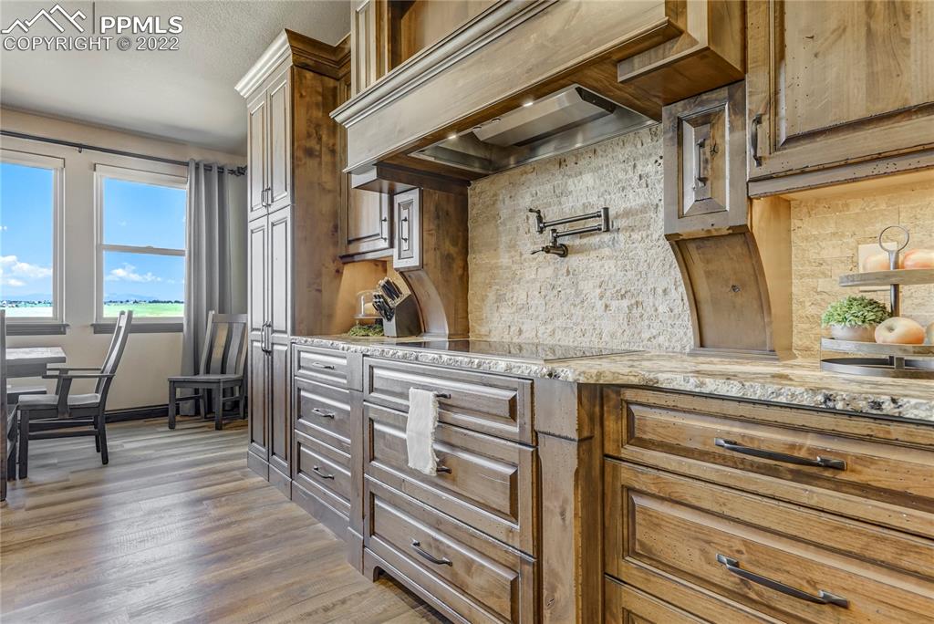 14325 Evans Road Elbert, CO 80106 - Photo 17 of 49 a view of cabinets and wooden floor
