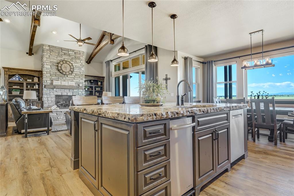 14325 Evans Road Elbert, CO 80106 - Photo 18 of 49 a kitchen with stainless steel appliances granite countertop a stove and cabinets