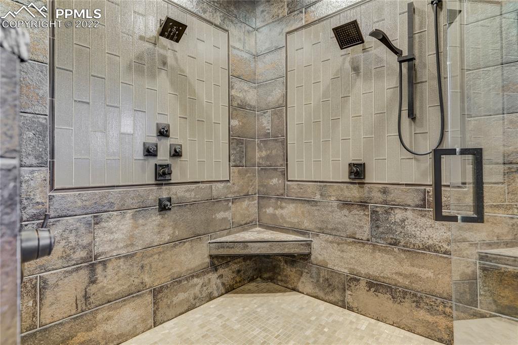 14325 Evans Road Elbert, CO 80106 - Photo 25 of 49 a bathroom with a shower and a mirror