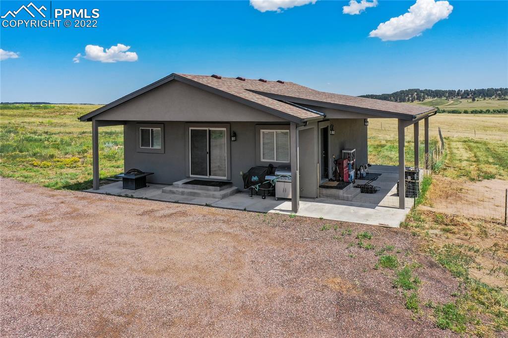 14325 Evans Road Elbert, CO 80106 - Photo 3 of 49 a view of a house with porch and furniture