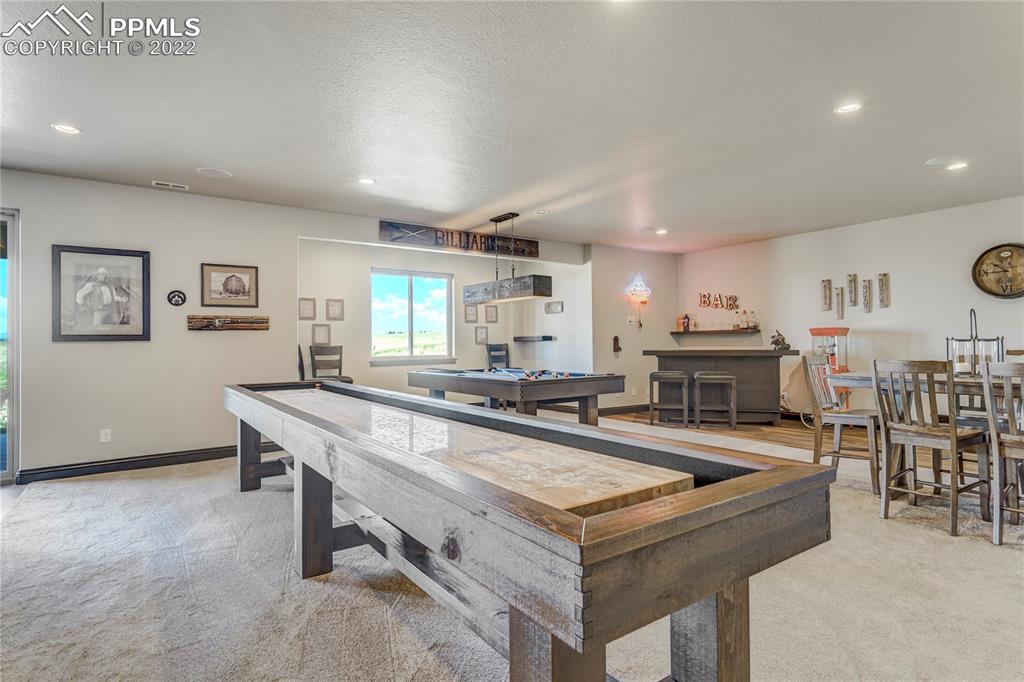 14325 Evans Road Elbert, CO 80106 - Photo 34 of 49 a kitchen with stainless steel appliances a table and chairs in it