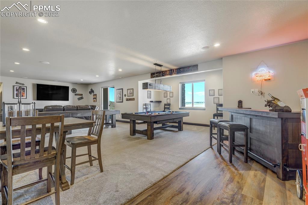 14325 Evans Road Elbert, CO 80106 - Photo 35 of 49 a living room with furniture and a flat screen tv