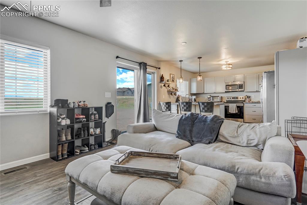 14325 Evans Road Elbert, CO 80106 - Photo 43 of 49 a living room with furniture kitchen view and a window