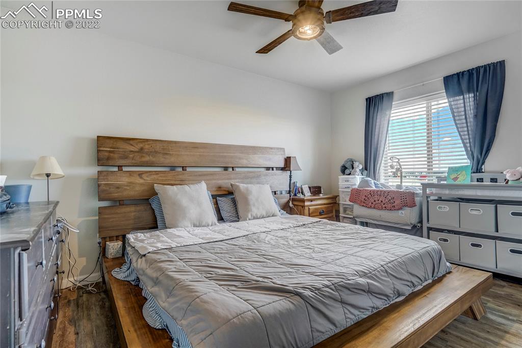 14325 Evans Road Elbert, CO 80106 - Photo 45 of 49 a bedroom with a bed and two windows