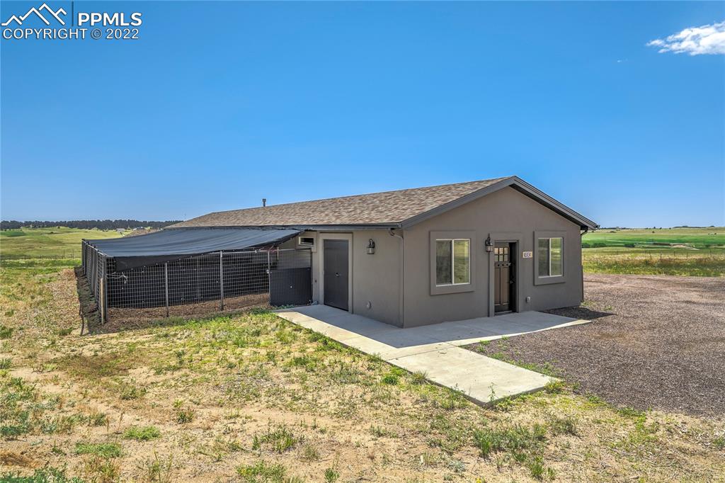 14325 Evans Road Elbert, CO 80106 - Photo 47 of 49 a front view of a house with a yard