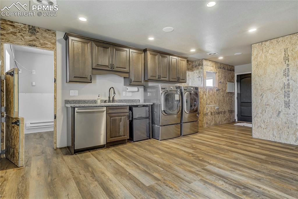 14325 Evans Road Elbert, CO 80106 - Photo 49 of 49 a kitchen with stainless steel appliances granite countertop a sink a stove a refrigerator and cabinets