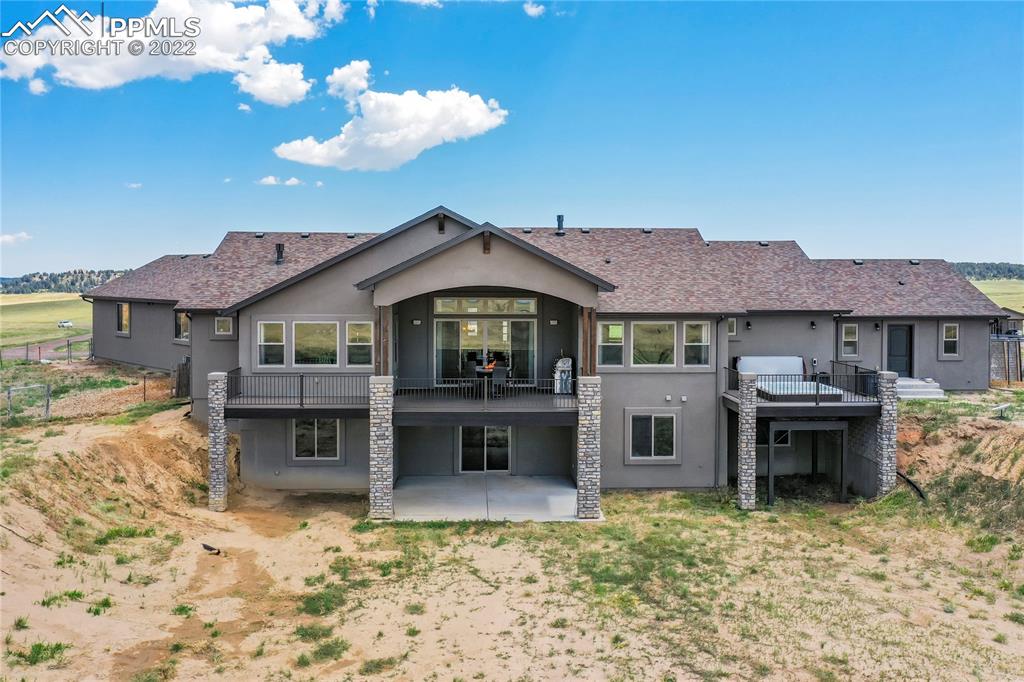 14325 Evans Road Elbert, CO 80106 - Photo 5 of 49 a front view of a house with a yard