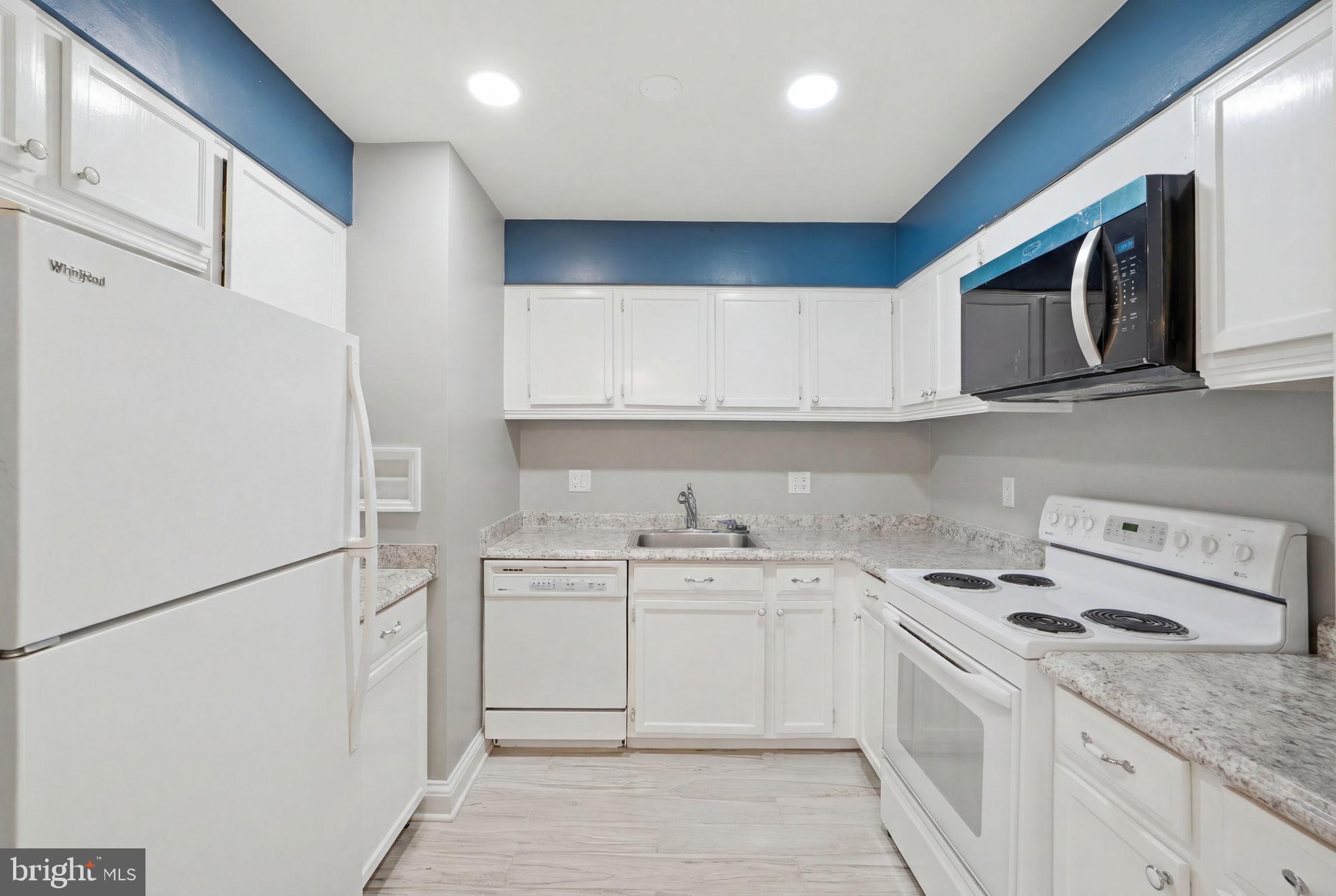 6141 Edsall Road, Unit E Alexandria, VA 22304 - Photo 8 of 16 Modern kitchen with sleek finishes.