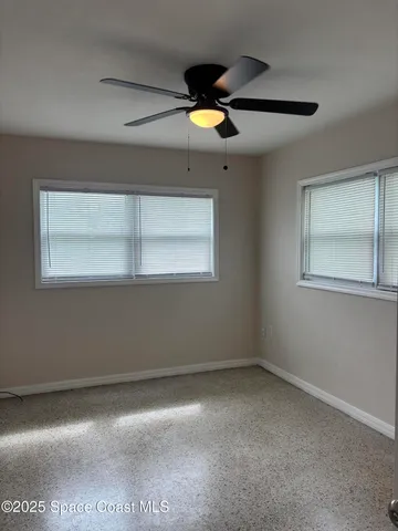 a view of empty room with windows