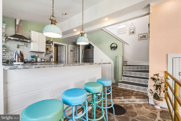 a view of a kitchen and dining room