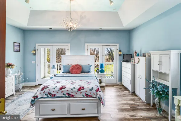 a bed room with a bed window and dresser