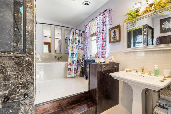 a view of a bathroom with sink and dishwasher