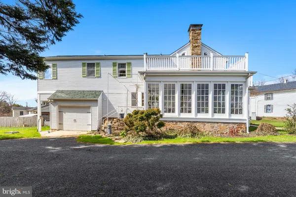 a front view of a house with swimming pool