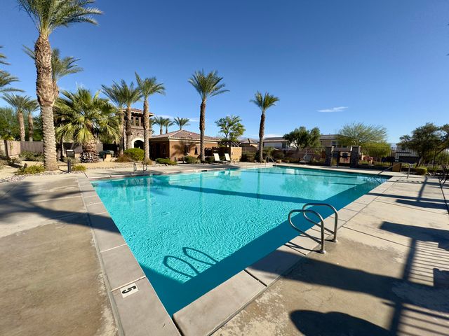 a view of a patio with swimming pool