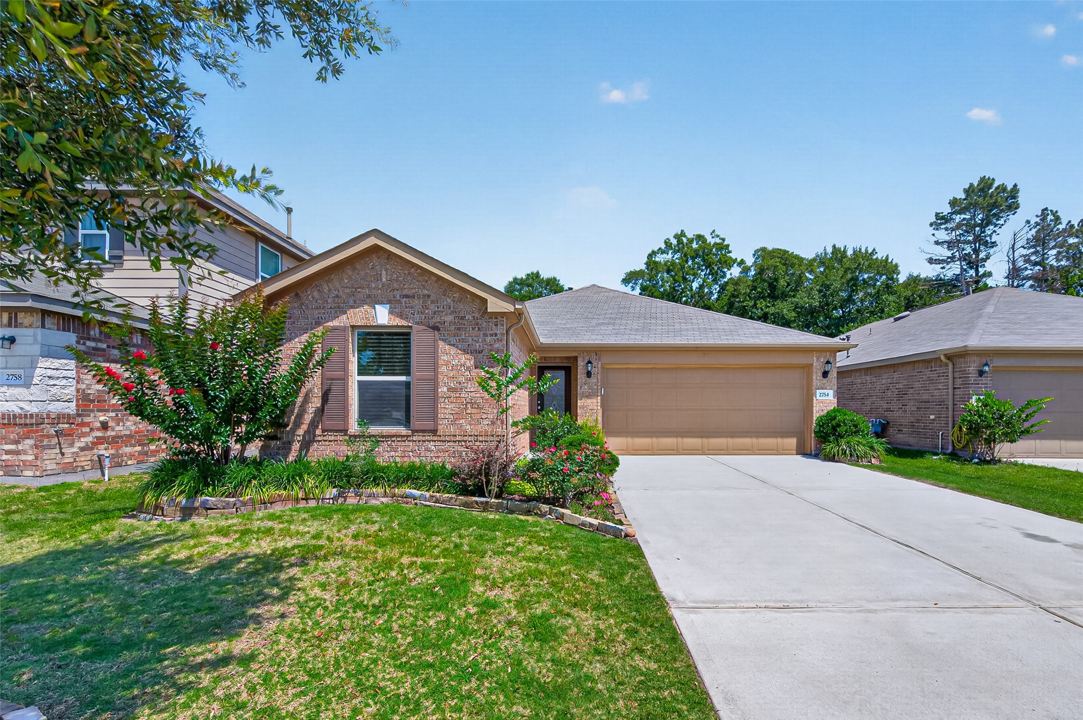 2754 Cayden Creek Way Conroe, TX 77304 - Photo 1 of 40 front view of house with a yard