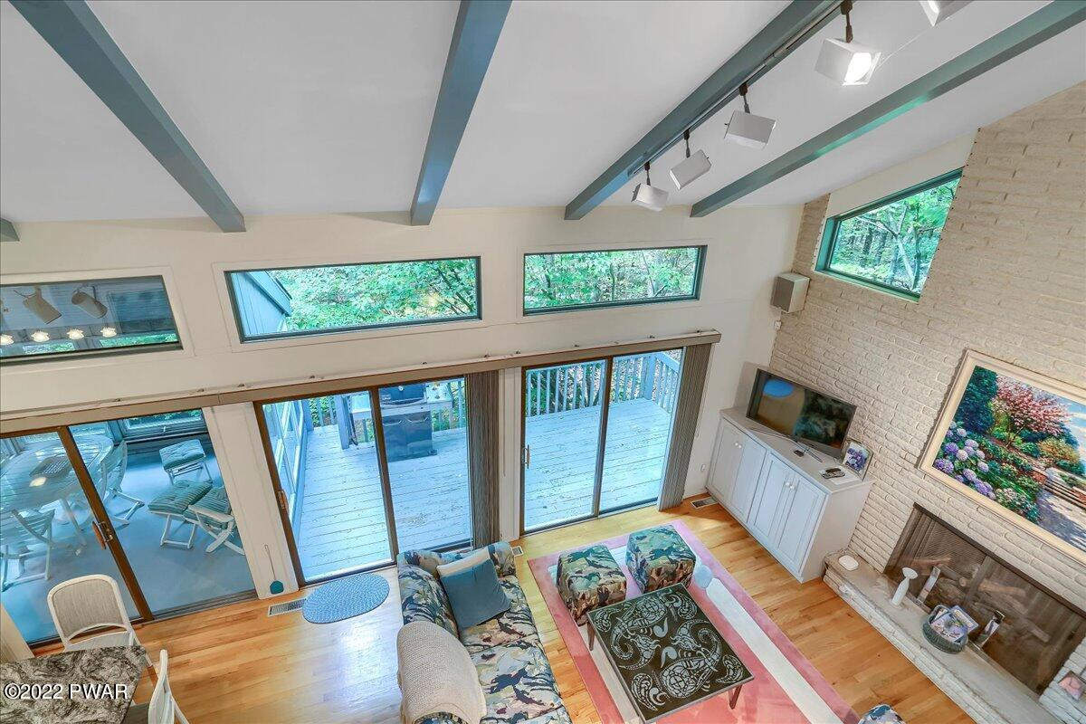 110 Ridge Road Hawley, PA 18428 - Photo 20 of 49 a bedroom with furniture and a flat screen tv
