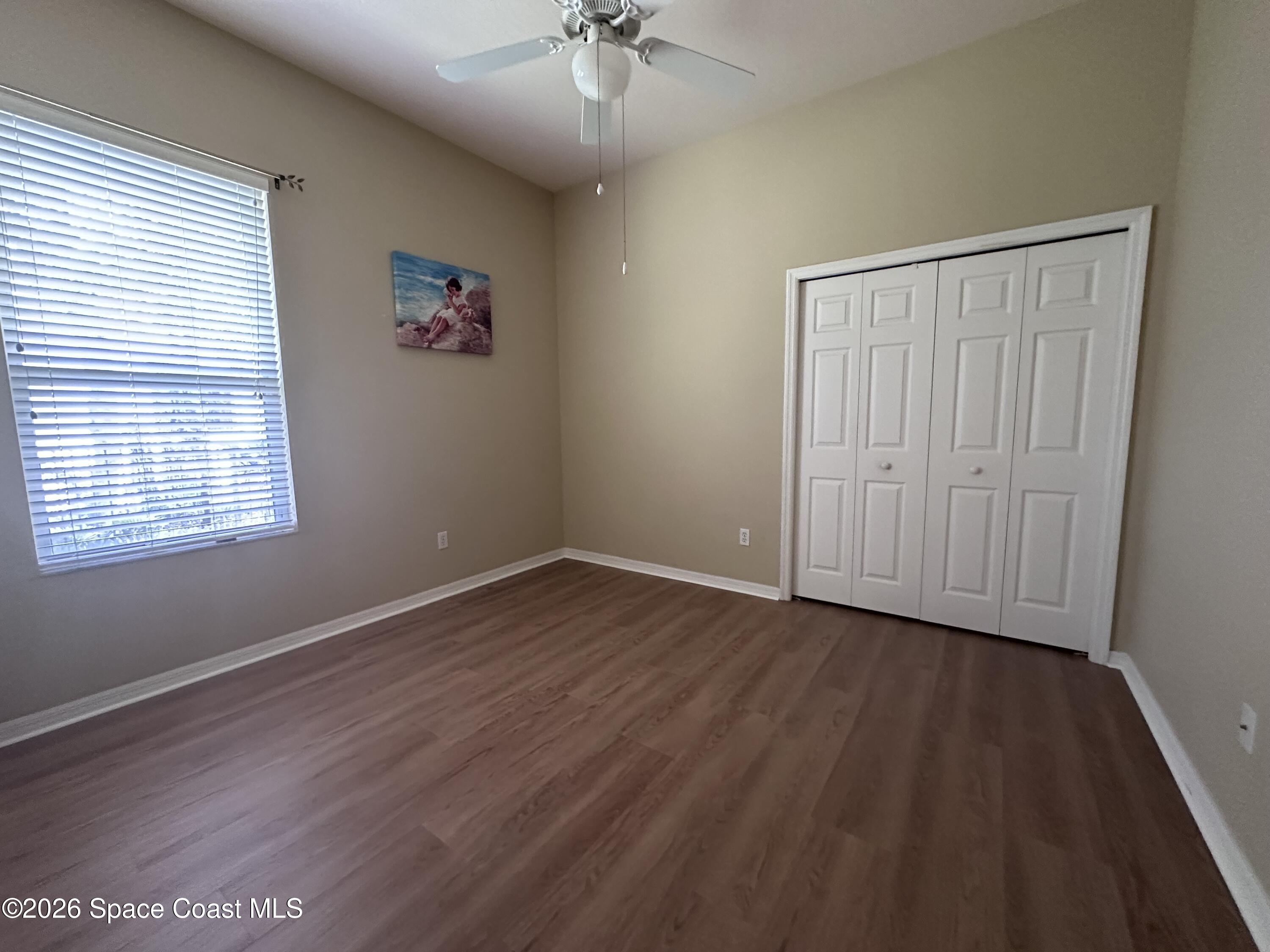 883 Spring Oak Drive Melbourne, FL 32901 - Photo 30 of 45 wooden floor in an empty room with a window