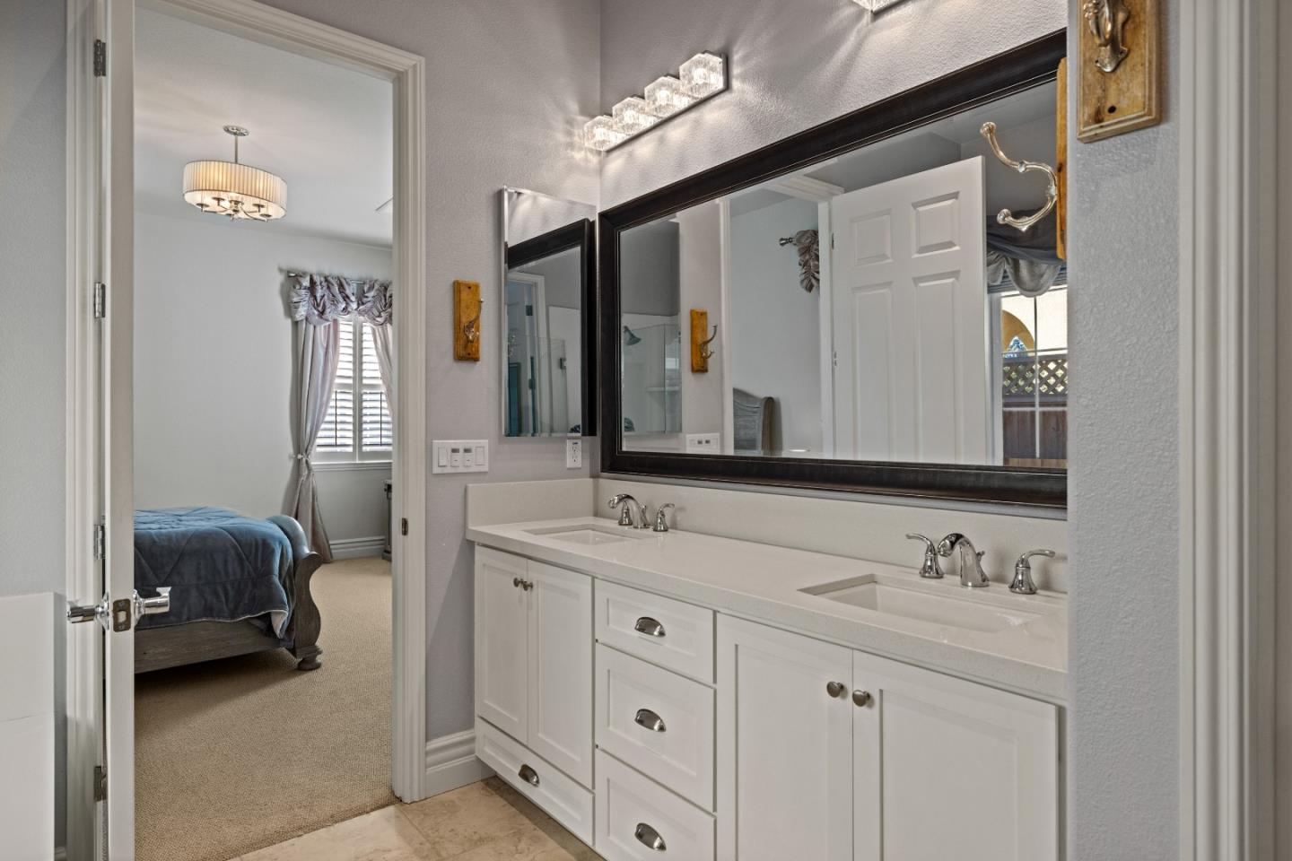 18511 McClellan Circle East Garrison, CA 93933 - Photo 30 of 65 a bathroom with a sink double vanity and a mirror