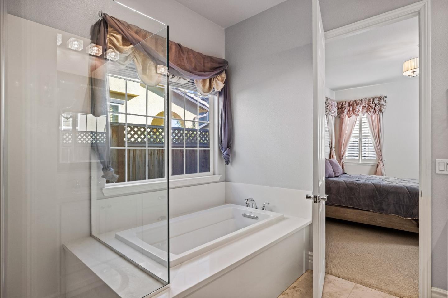 18511 McClellan Circle East Garrison, CA 93933 - Photo 31 of 65 a bathroom with a tub sink and mirror