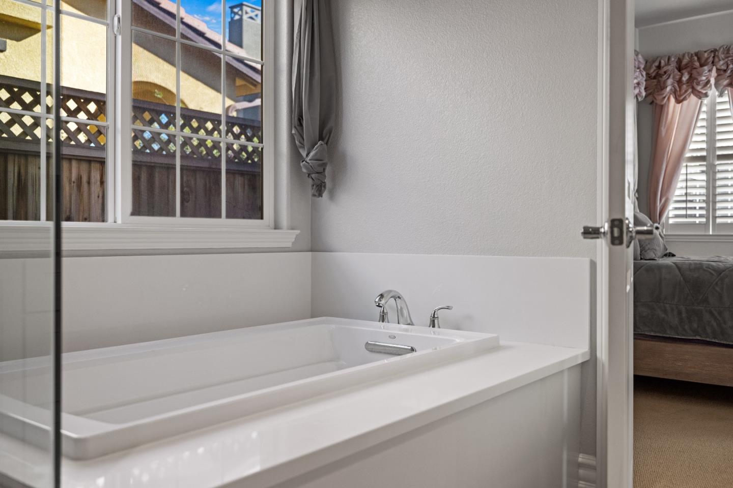 18511 McClellan Circle East Garrison, CA 93933 - Photo 32 of 65 a bathroom with a bathtub and a sink